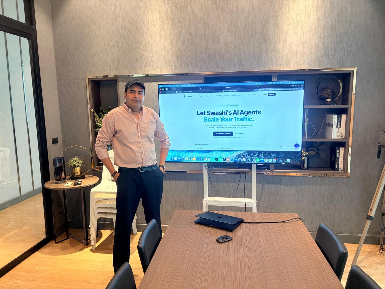Waqar Abro presenting the Swashi platform on a boardroom screen